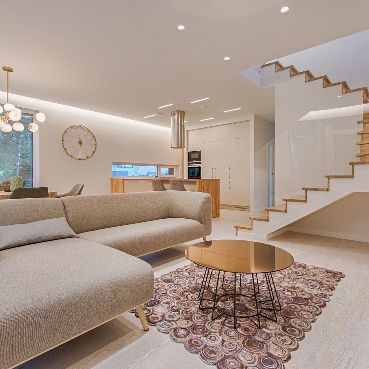 A living room with a blue area rug